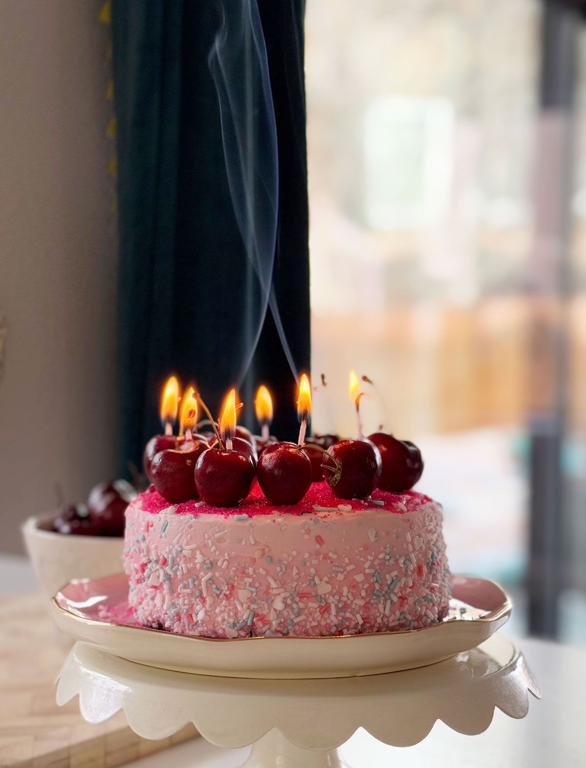 Cherry candle cake with real cherry candles.