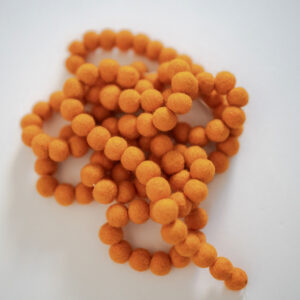 Orange felt ball garland for fall.