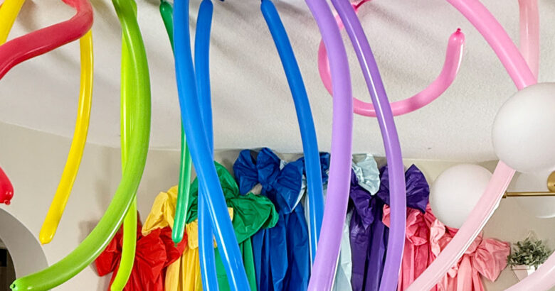 How to create a rainbow party balloon ceiling.