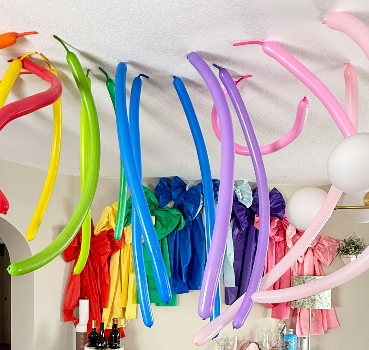 How to create a rainbow party balloon ceiling. 