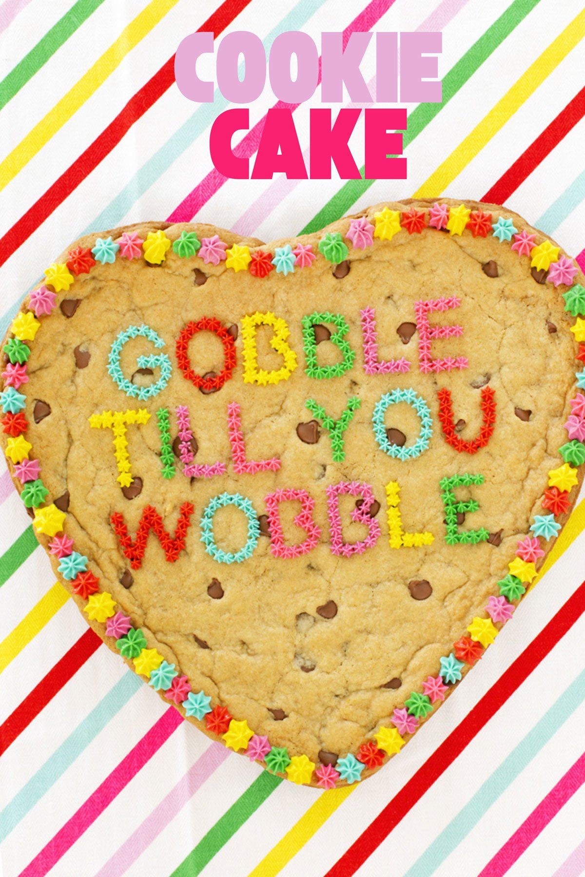 A gigantic chocolate chip cookie cake with frosting.